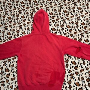 Fox racing hoodie.Rip in the right sleeve gives this hoodie a bit of personality